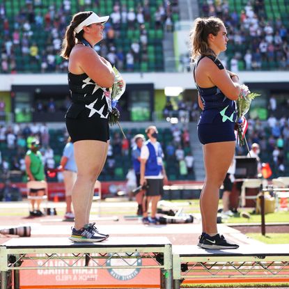eugene, oregon june 26 gwendolyn berry l, third place, turns away from us flag during the us national anthem as deanna price c, first place, and brooke andersen, second place, also stand on the podium after the womens hammer throw final on day nine of the 2020 us olympic track field team trials at hayward field on june 26, 2021 in eugene, oregon in 2019, the usopc reprimanded berry after her demonstration on the podium at the lima pan american games photo by patrick smithgetty images