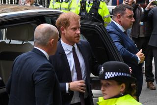 Prince Harry exiting a car and walking into High Court in the U.K.
