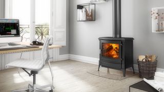 small log burning stove in home office