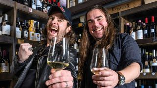 Joel and Ryan O'Keefe raise their wine glasses
