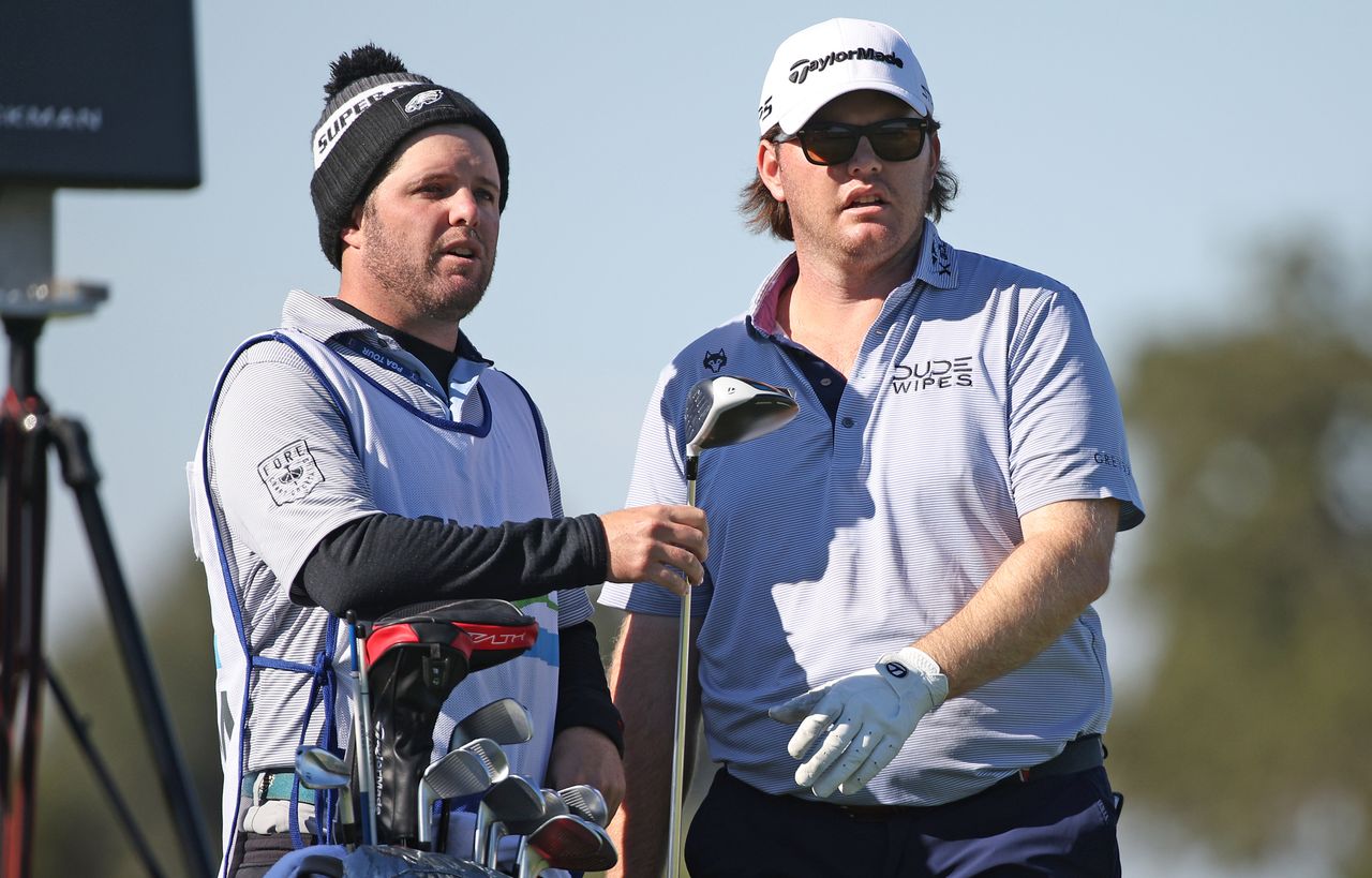 Harry Higgs with his caddie and brother Alex Higgs