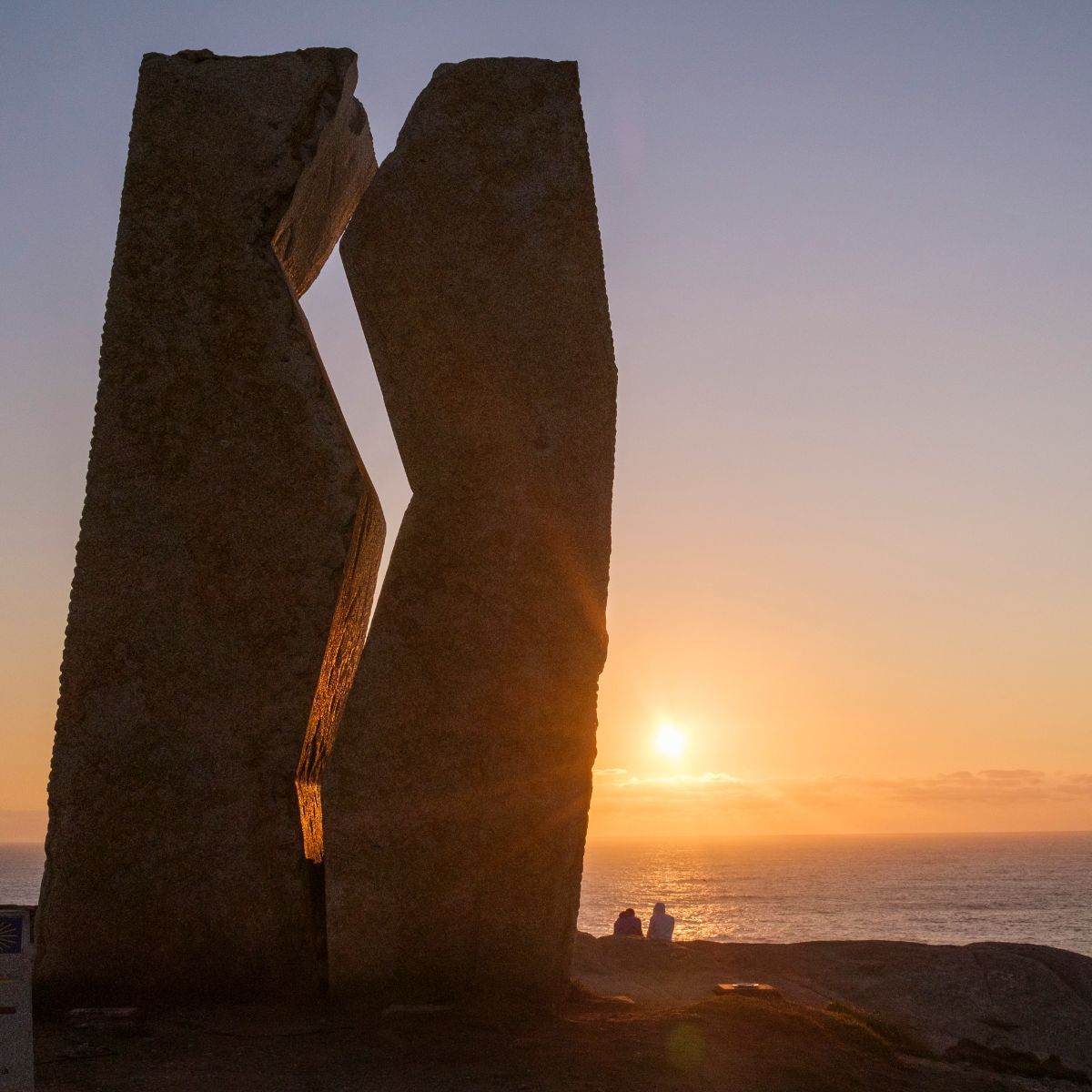 Pilgrims at the Costa da Morte, the endpoint of the Camino de Santiago.