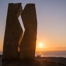 Pilgrims at the Costa da Morte, the endpoint of the Camino de Santiago.