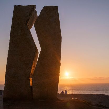 Pilgrims at the Costa da Morte, the endpoint of the Camino de Santiago.