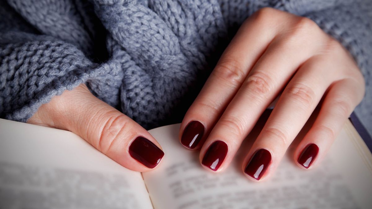 Woman showing gel nail polish on nails