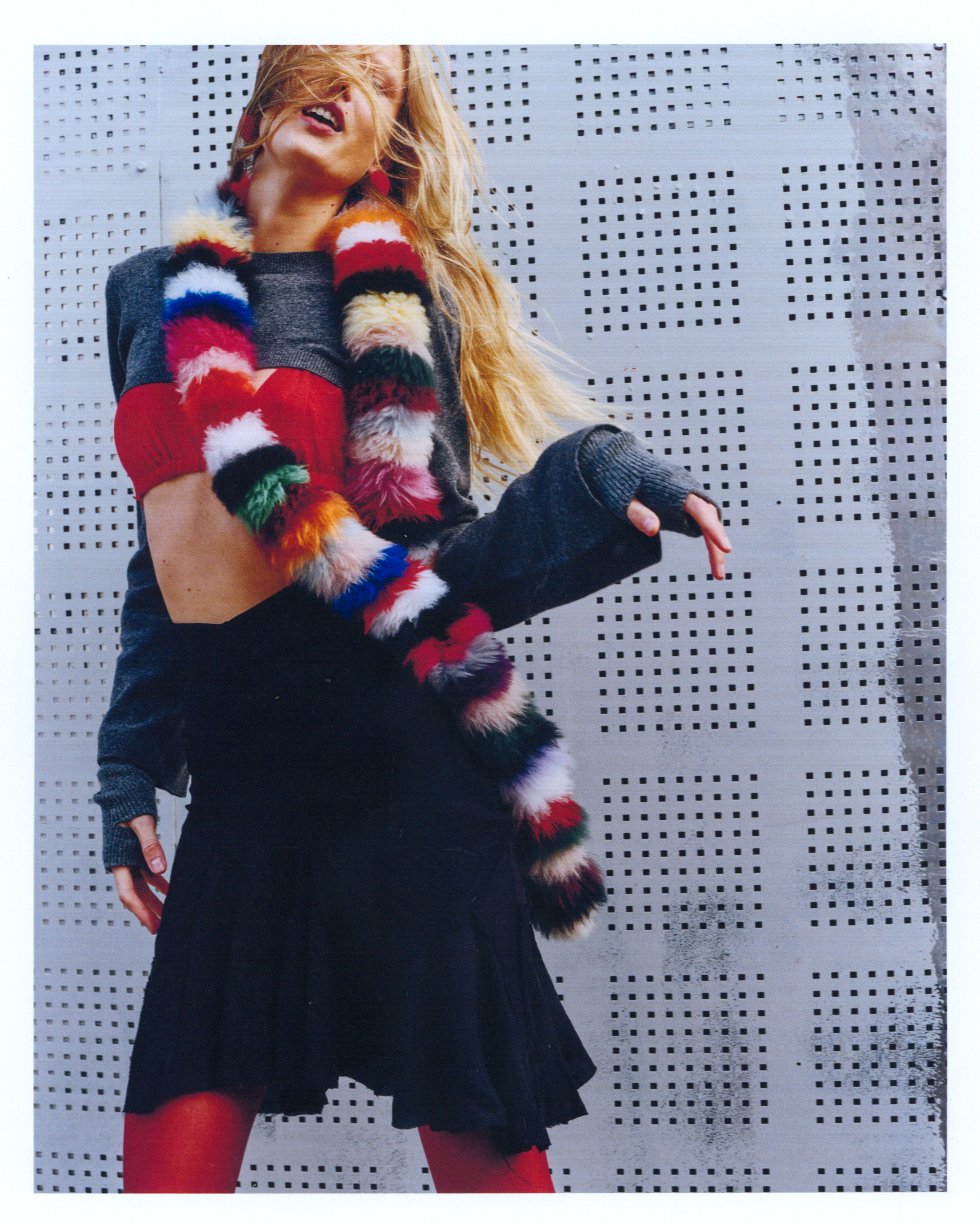 a model wearing a charlotte simone rainbow twist scarf