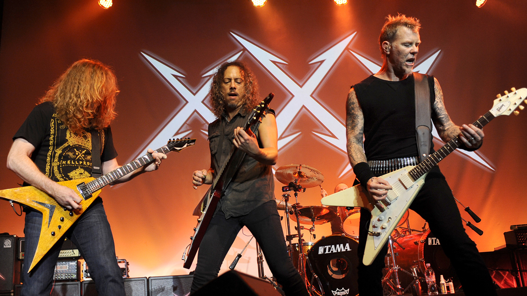 A picture of Dave Mustaine onstage with Metallica in 2011