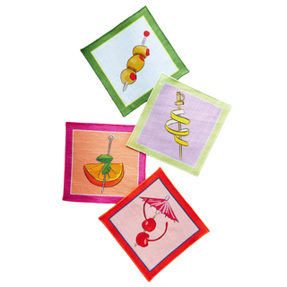 Set of four brightly colored cloth napkins, featuring illustrations of assorted cocktail garnishes 