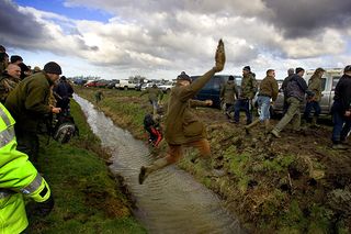 The Waterloo Cup, a hare coursing event, has been run at Altcar, near Liverpool since 1836. Due to the banning in February 2005, of hunting with dogs this was the last 3 days of a long country tradition. Police allowed protesters from the International Fund for Animal Welfare to attend. They said: "This Valentine's Day will hold no romance for British hares heralding as it does the start of the Waterloo Cup - a horrific event that derives pleasure from the pursuit and death of these wild mammals." However, The National Coursing Club claims that 7 out of 8 hares coursed survive argueing that flight is a natural response to the hare and deny charges of causing suffering. There was a fierce altercation between the 150 protesters and many of the 10,000 attendees. Police arrested several coursing followers, some of whom tried to reach the protesters. | Location: Altc (Photo by In Pictures Ltd./Corbis via Getty Images)