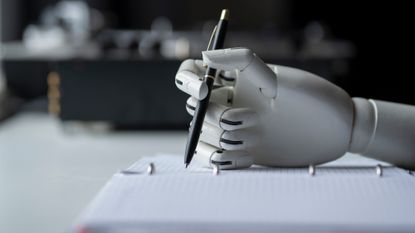 A robot hand holding a pen. 