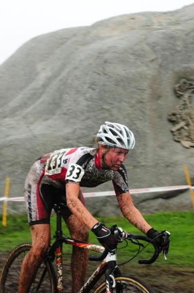 Gesa Bruechman (Stevens) riding in front of a monster boulder