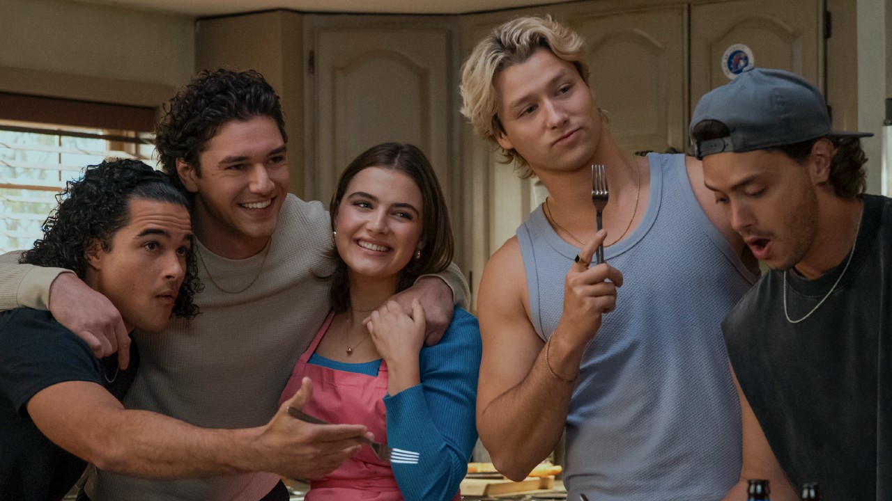 From left to right: Tucker, Garrett and Hannah posing together, Dean holding up a fork and Logan looking down. 