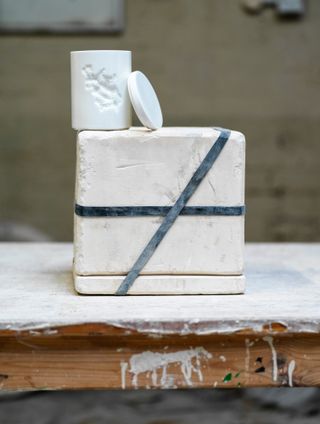 White ceramic vessel candle holder