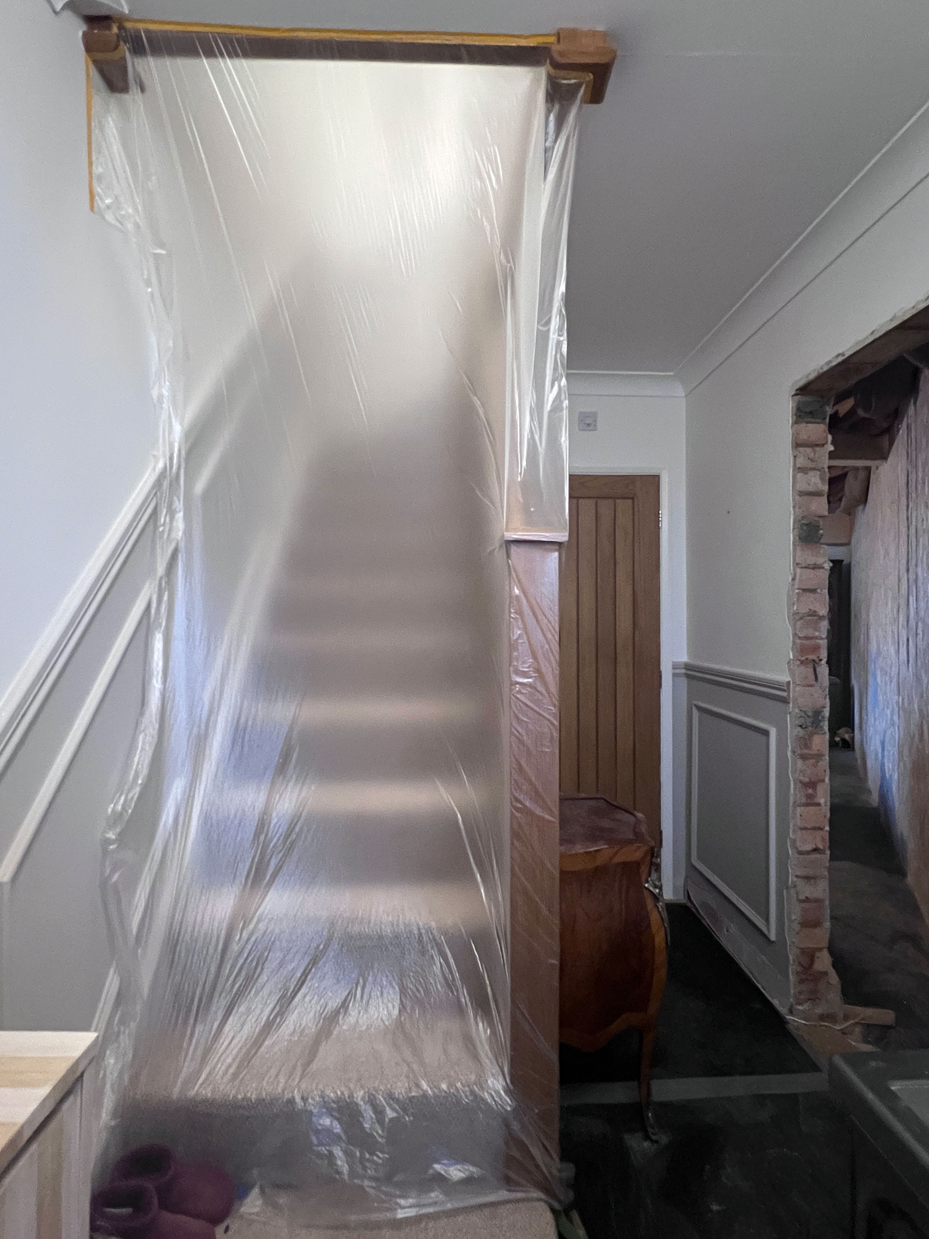 Translucent dust sheet protecting staircase during renovation