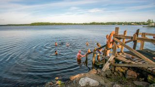 a photo of people cold water swimming