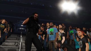 Promotional screenshot of Seth Rollins walking through the crowd in WWE 2K25