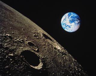 The surface of the moon with Earth in the background. (Composite image)