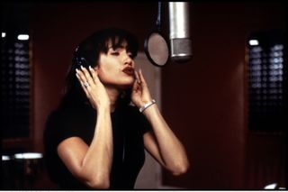 Jennifer Lopez as Selena Quintanilla singing in a recording studio in 'Selena'