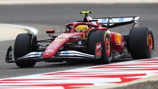 Lewis Hamilton driving his Ferrari round a bend during Bahrain testing for the 2025 season.