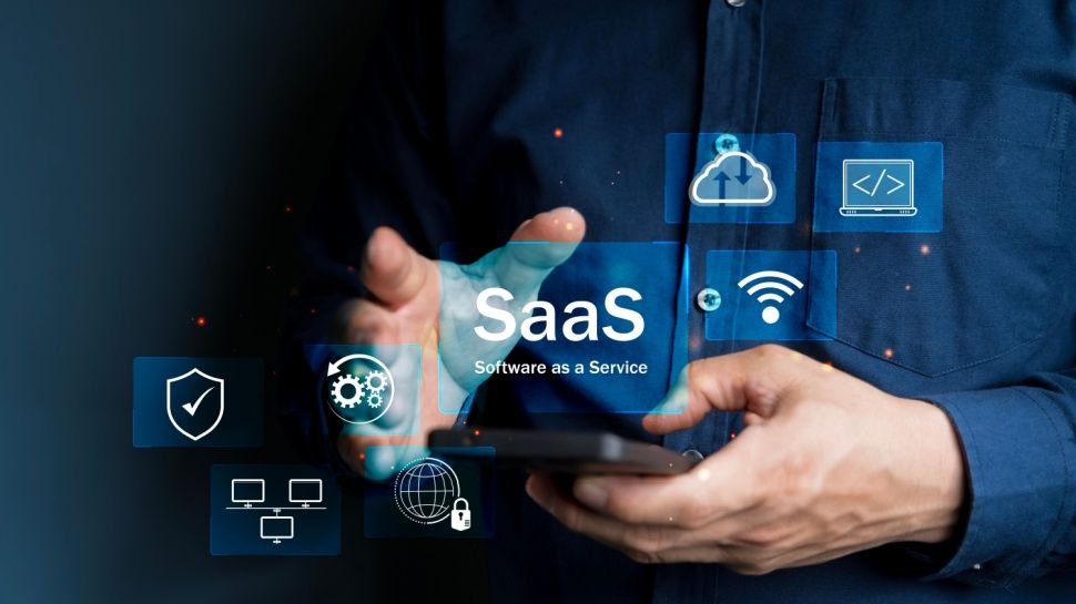 SaaS Concept, Software as a Service, A man types smartphone with digital icons representing various aspects of Software as a Service (SaaS), emphasizing modern technology platforms and cloud computing