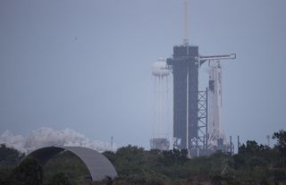 A SpaceX Falcon 9 rocket test fires its first-stage engines briefly atop Pad 39A at NASA's Kennedy Space Center in Cape Canaveral, Florida on Nov. 14, 2020. The rocket will launch the Crew-1 astronaut mission for NASA on Nov. 14.