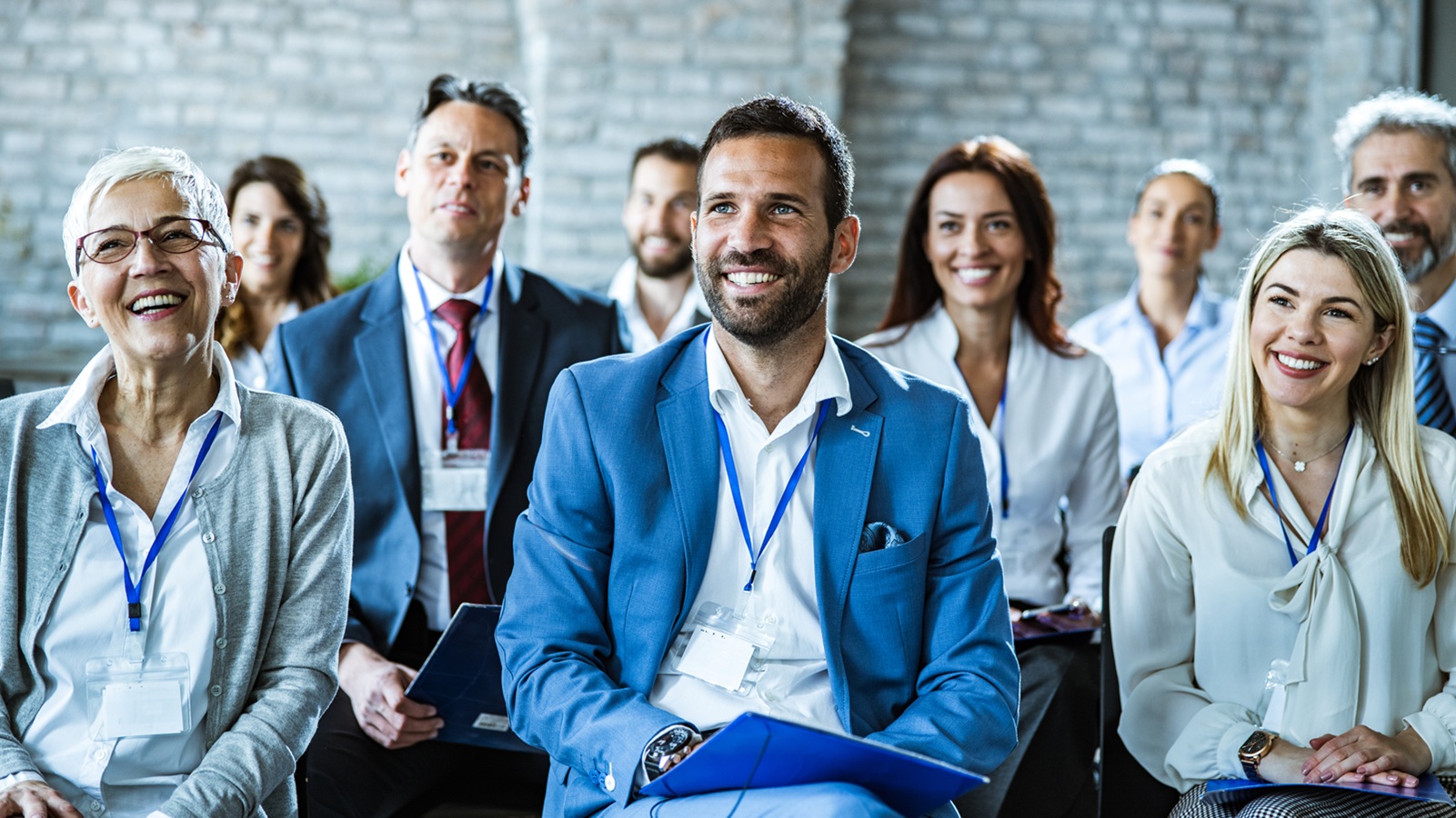 Large group of happy business people having an education event in board room.