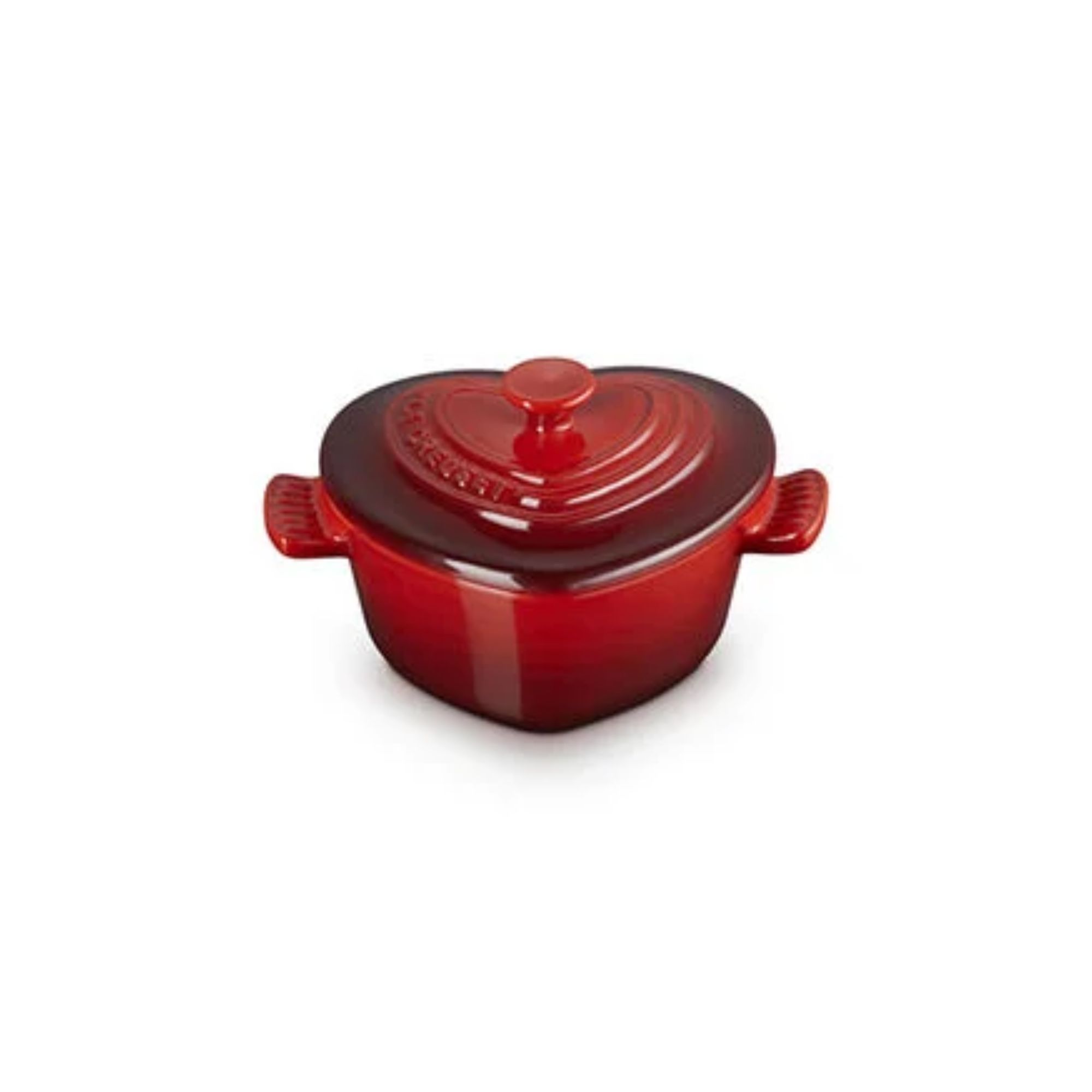 A red heart shaped mini cooking both with matching lid