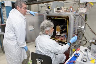 The E. coli AntiMicrobial Satellite (EcAMSat) undergoes testing at NASA's Ames Research Center in Mountain View, California.