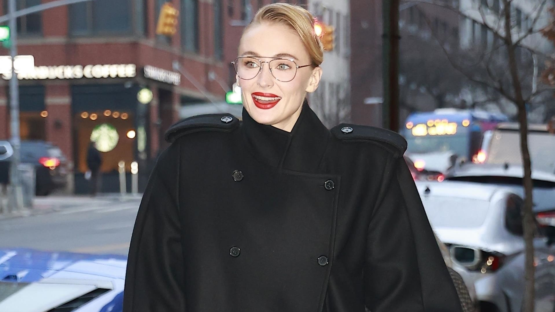 Sophie Turner arrived in New York City wearing an oversize take on the military coat trend