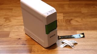 Epson LabelWorks LW-C410 review; a small label printer on a wooden table