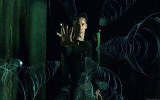 Neo hält in The Matrix einen Haufen Kugeln mit seiner Hand auf.