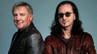 Musicians Alex Lifeson and Geddy Lee from the band Rush attend the Tribeca Film Festival 2010 portrait studio at the FilmMaker Industry Press Center on April 24, 2010 in New York, New York.