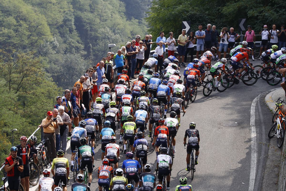 The riders heading uphill