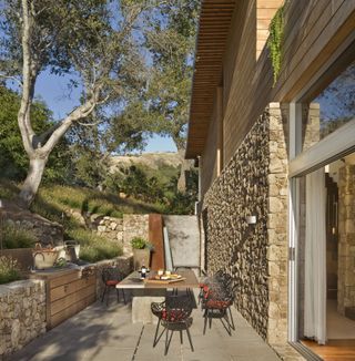 An outdoor kitchen with built-in storage drawers