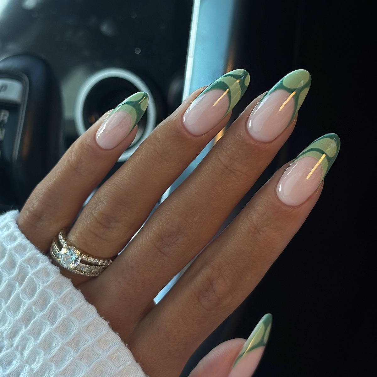 Green marbled French tip nail design