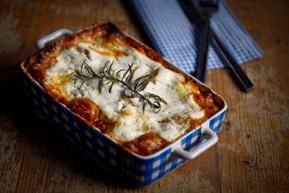 Slimming World's beef lasagne in blue decorated oven dish