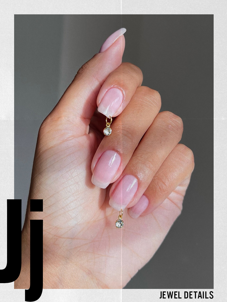 A clear manicure with jewel detailing