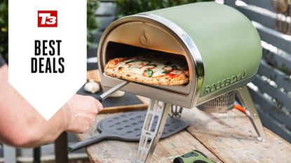 Lifestyle image of the Gozney Roccbox with pizza inside, with a T3 Best Deals badge in the left hand corner