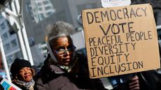 Members of the National Action Network protest outside the office of hedge fund billionaire Bill Ackman, New York, 4 January 2024