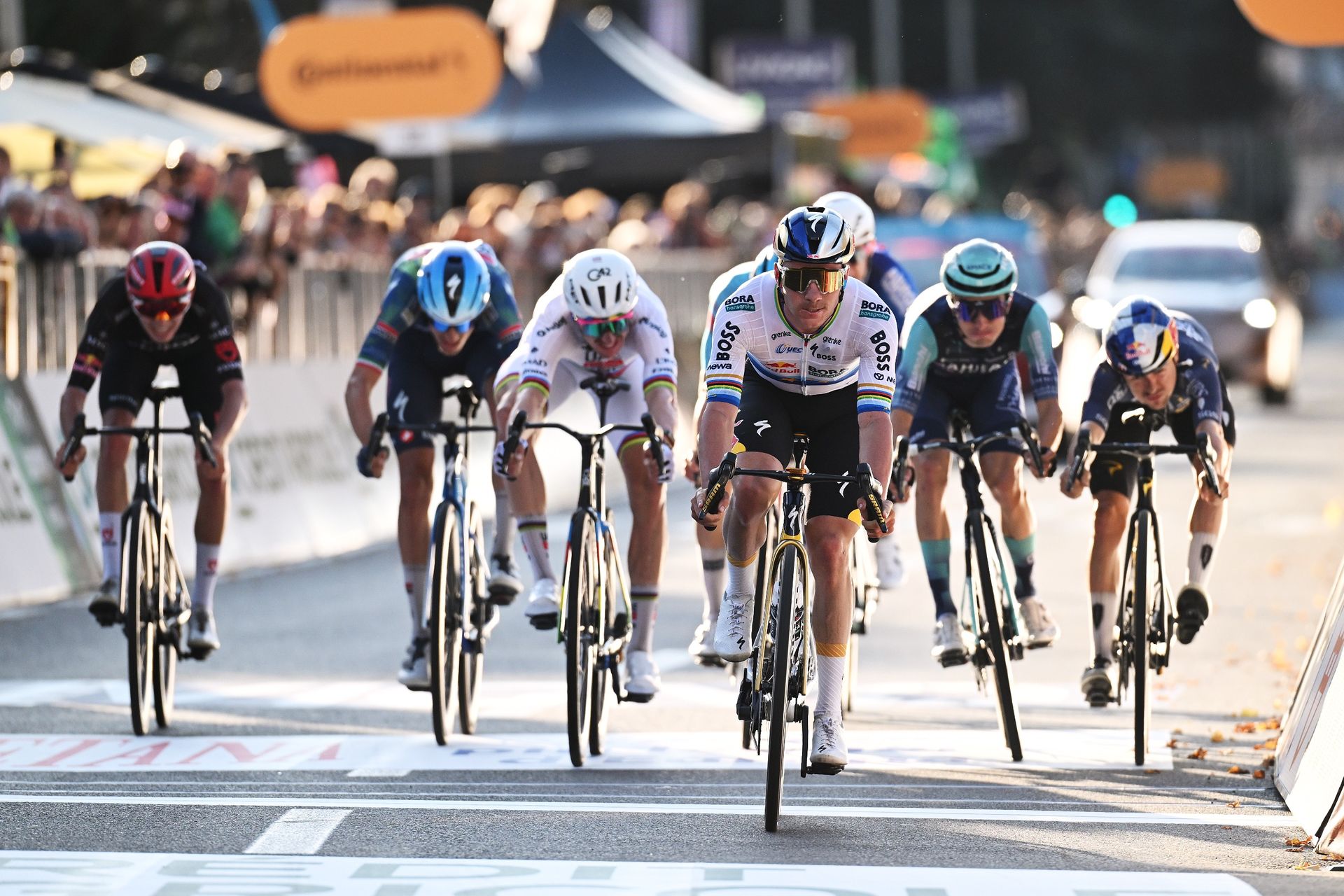 Remco Evenepoel leads home a chase group of seven riders to finish in fourth place at Il Lombardia 2026