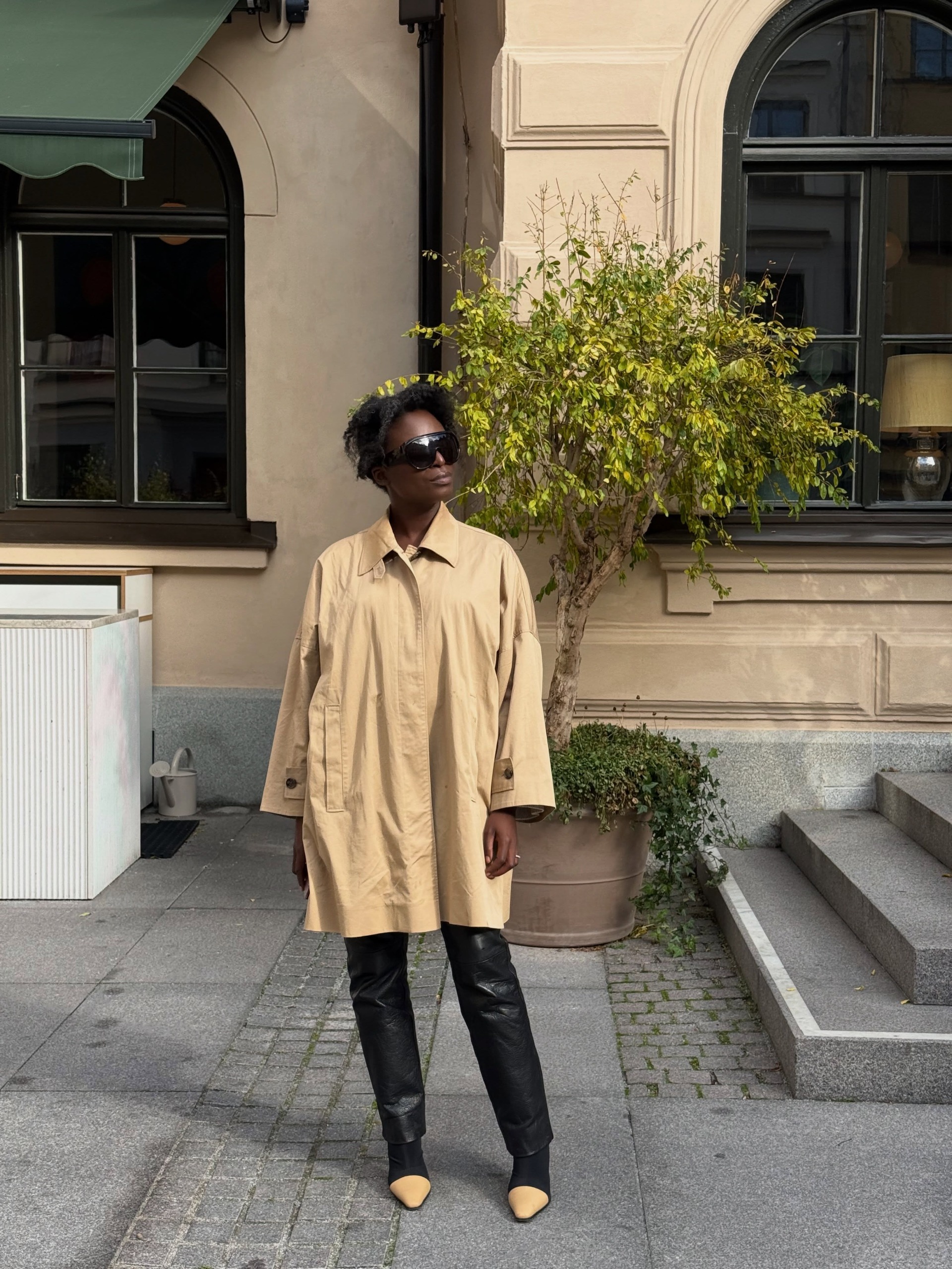 A woman wearing a fall leather-pant outfit in 2026.