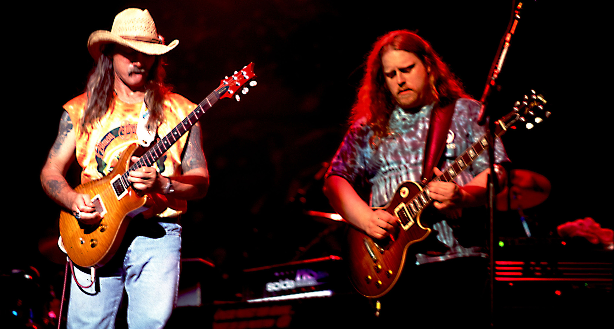 Dickey Betts and Warren Haynes play together with the Allman Brothers, with Betts on his PRS, Haynes on his Les Paul Standard.