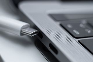 White charging cable and two identical usb type-c connectors on macbook pro 2019