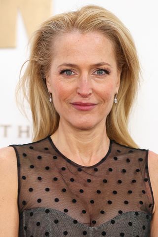 Gillian Anderson is pictured with blonde/grey hair whilst attending "The Crown" Finale Celebration at The Royal Festival Hall on December 05, 2023 in London, England.
