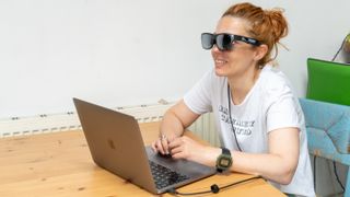 Woman Using TCL Nxtwear S with MacBook Pro 13