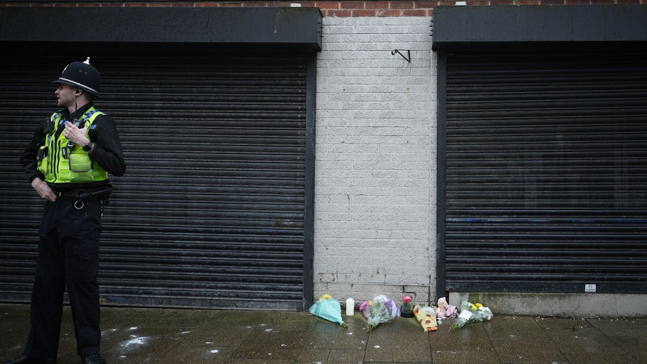 A police officer outside the funeral directors