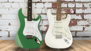 PRS SE Silver Sky in Ever Green and Fender Player Stratocaster in Polar White in front of a white brick wall