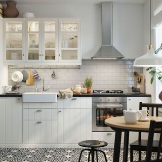 white modular kitchen with tiled flooring