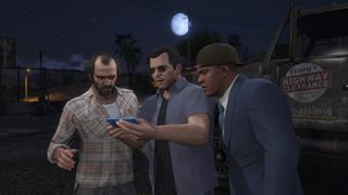 Trevor, Michael and Franklin stare at phone in GTA V