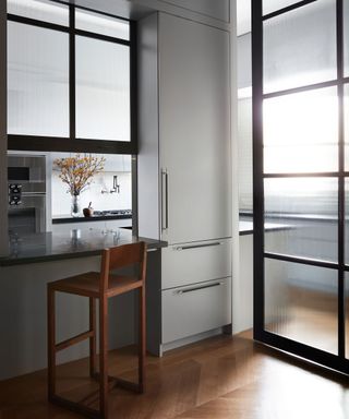 grey kitchen with glass doors